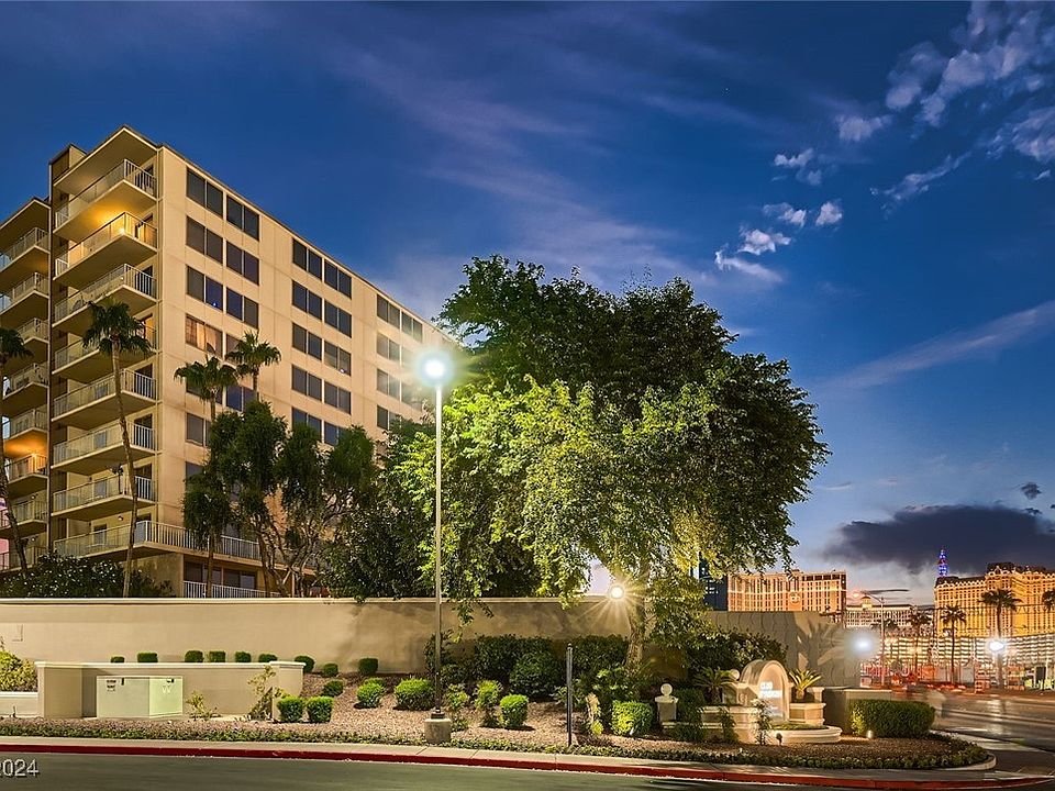 Marie Antoinette Condominiums exterior at dusk