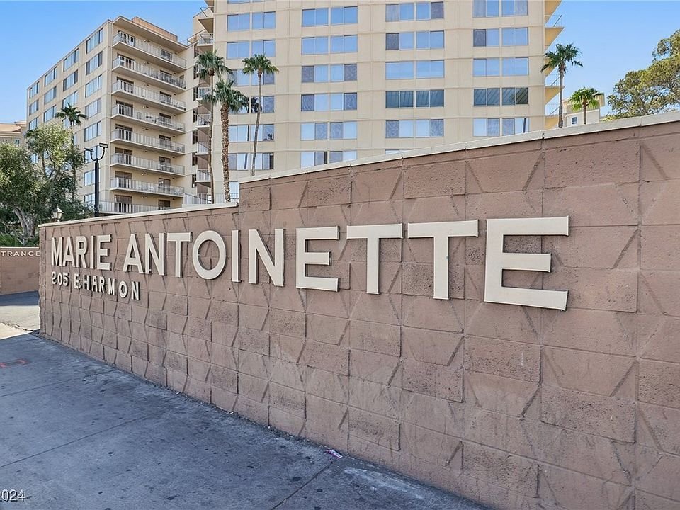 Marie Antoinette entrance sign at 205 E Harmon